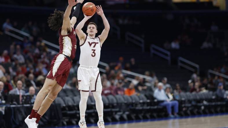 Mar 13, 2024; Washington, D.C., USA; Virginia Tech Hokies guard Sean Pedulla (3) shoots the ball as Florida State Seminoles guard Jalen Warley (1) defends in the first half at Capital One Arena. Mandatory Credit: Geoff Burke-USA TODAY Sports