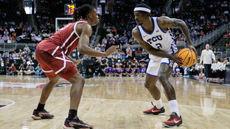 Mar 13, 2024; Kansas City, MO, USA; Oklahoma Sooners guard Otega Oweh (3) guards TCU Horned Frogs forward Emanuel Miller (2) during the first half at T-Mobile Center. Mandatory Credit: William Purnell-USA TODAY Sports