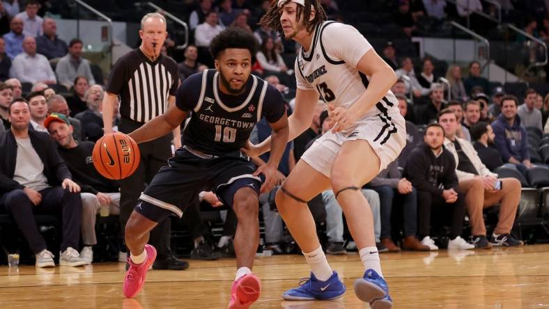 Mar 13, 2024; New York City, NY, USA; Georgetown Hoyas guard Jayden Epps (10) drives to the basket against Providence Friars forward Josh Oduro (13) during the first half at Madison Square Garden. Mandatory Credit: Brad Penner-USA TODAY Sports