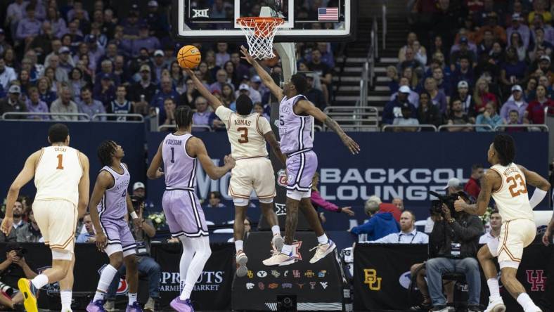 Mar 13, 2024; Kansas City, MO, USA; Texas Longhorns guard Max Abmas (3) shoots the ball while defended by Kansas State Wildcats guard Cam Carter (5) during the first half at T-Mobile Center. Mandatory Credit: Amy Kontras-USA TODAY Sports