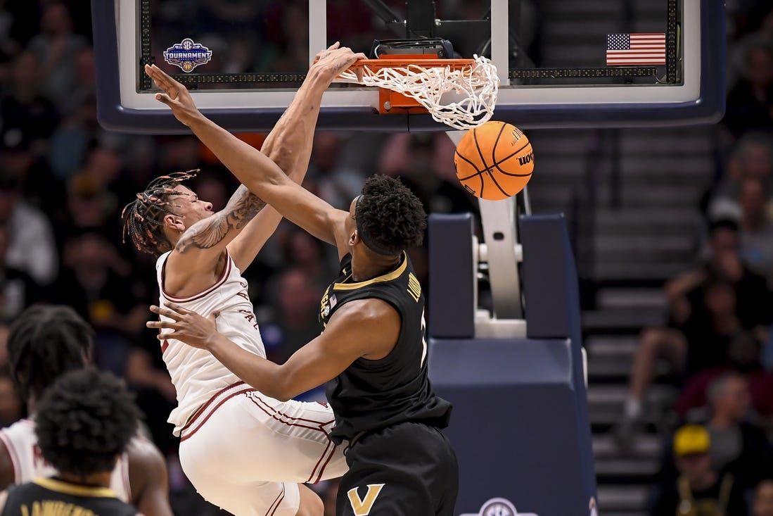 Mar 13, 2024; Nashville, TN, USA;  Arkansas Razorbacks forward Trevon Brazile (2) slams the ball over Vanderbilt Commodores forward Ven-Allen Lubin (2) during the first half at Bridgestone Arena. Mandatory Credit: Steve Roberts-USA TODAY Sports