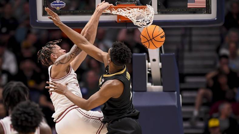 Mar 13, 2024; Nashville, TN, USA;  Arkansas Razorbacks forward Trevon Brazile (2) slams the ball over Vanderbilt Commodores forward Ven-Allen Lubin (2) during the first half at Bridgestone Arena. Mandatory Credit: Steve Roberts-USA TODAY Sports