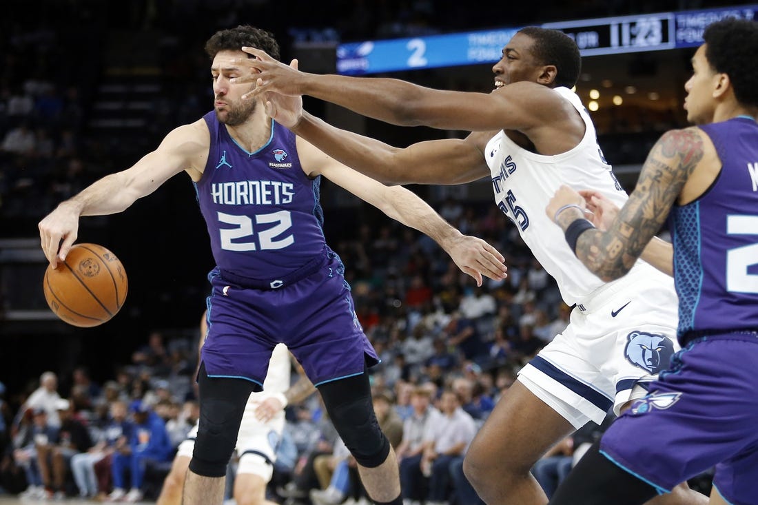 Mar 12, 2024; Memphis, Tennessee, USA; Charlotte Hornets guard Vasilije Micic (22) and Memphis Grizzlies center Trey Jemison (55) battle for a rebound during the first half at FedExForum. Mandatory Credit: Petre Thomas-USA TODAY Sports