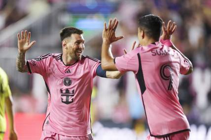 Mar 13, 2024; Fort Lauderdale, FL, USA;  Inter Miami CF forward Lionel Messi (10) celebrates after scoring a goal with forward Luis Suarez (9) against the Nashville SC in the first half during the Concacaf round of sixteen at Chase Stadium. Mandatory Credit: Nathan Ray Seebeck-USA TODAY Sports