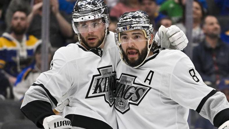 Mar 13, 2024; St. Louis, Missouri, USA;  Los Angeles Kings right wing Adrian Kempe (9) celebrates with defenseman Drew Doughty (8) after scoring against the St. Louis Blues during the third period at Enterprise Center. Mandatory Credit: Jeff Curry-USA TODAY Sports