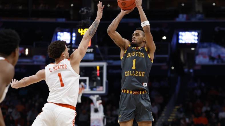 Mar 13, 2024; Washington, D.C., USA; Boston College Eagles guard Claudell Harris Jr. (1) shoots the ball over Clemson Tigers guard Chase Hunter (1) in the first half at Capital One Arena. Mandatory Credit: Geoff Burke-USA TODAY Sports