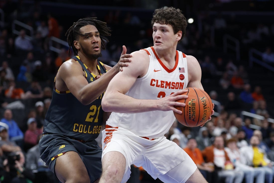 Mar 13, 2024; Washington, D.C., USA; Clemson Tigers center PJ Hall (24) drives to the basket as Boston College Eagles forward Devin McGlockton (21) defends in the second half at Capital One Arena. Mandatory Credit: Geoff Burke-USA TODAY Sports