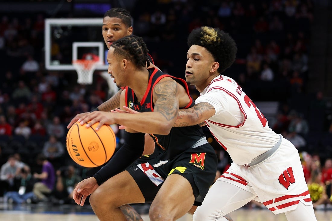 Mar 14, 2024; Minneapolis, MN, USA; Maryland Terrapins guard Jahmir Young (1) dribbles as Wisconsin Badgers guard Chucky Hepburn (23) defends during the first half at Target Center. Mandatory Credit: Matt Krohn-USA TODAY Sports