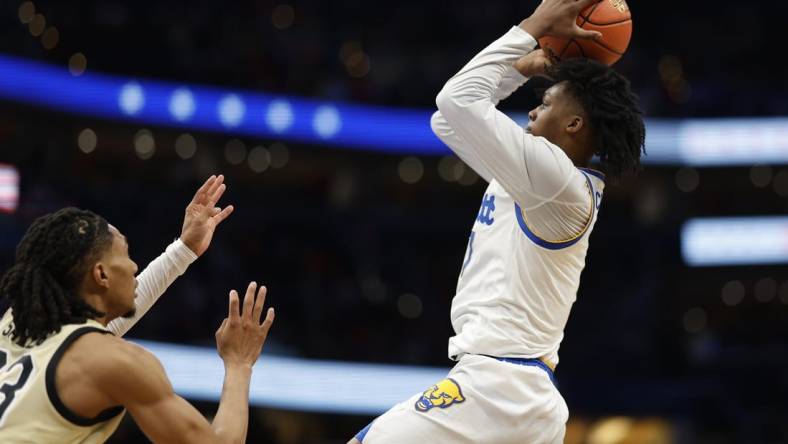 Mar 14, 2024; Washington, D.C., USA; Pittsburgh Panthers guard Carlton Carrington (7) shoots the ball as Wake Forest Demon Deacons guard Hunter Sallis (23) in the first half at Capital One Arena. Mandatory Credit: Geoff Burke-USA TODAY Sports