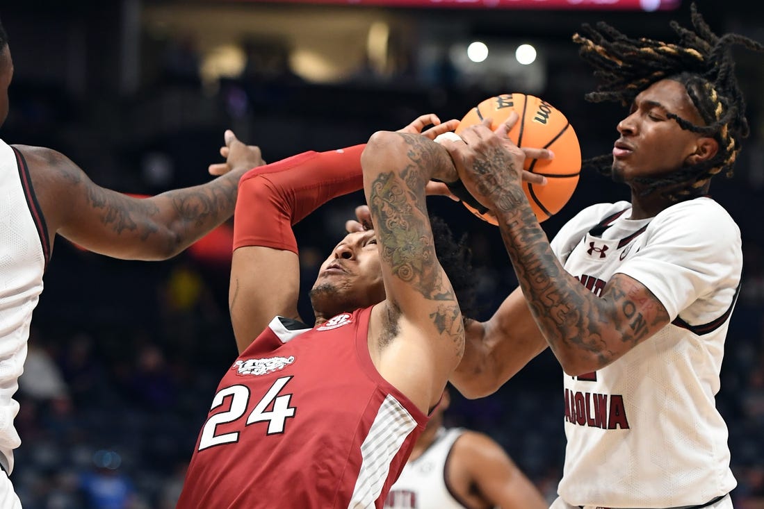 Mar 14, 2024; Nashville, TN, USA; Arkansas Razorbacks guard Jeremiah Davenport (24) tries to grab a rebound against South Carolina Gamecocks guard Zachary Davis (12) during the first half at Bridgestone Arena. Mandatory Credit: Christopher Hanewinckel-USA TODAY Sports