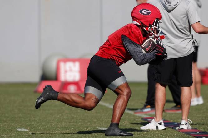 Georgia running back Trevor Etienne (1) runs a drill during spring practice in Athens, Ga., on Thursday, March 14, 2024.