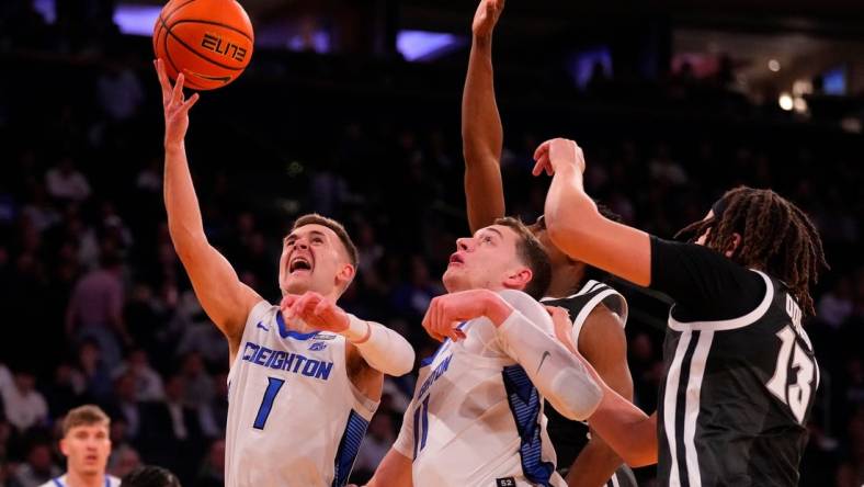 Mar 14, 2024; New York City, NY, USA;  Creighton Bluejays guard Steven Ashworth (1) shoots over the Providence Friars defense during the first half at Madison Square Garden. Mandatory Credit: Robert Deutsch-USA TODAY Sports