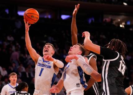 Mar 14, 2024; New York City, NY, USA;  Creighton Bluejays guard Steven Ashworth (1) shoots over the Providence Friars defense during the first half at Madison Square Garden. Mandatory Credit: Robert Deutsch-USA TODAY Sports
