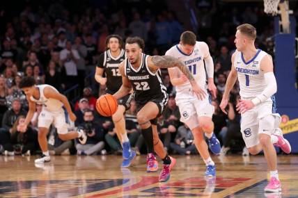 Mar 14, 2024; New York City, NY, USA; Providence Friars guard Devin Carter (22) brings the ball up court against Creighton Bluejays center Ryan Kalkbrenner (11) and guard Steven Ashworth (1) during the first half at Madison Square Garden. Mandatory Credit: Brad Penner-USA TODAY Sports