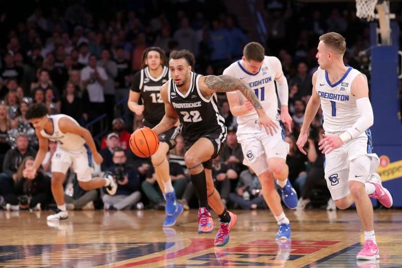 Mar 14, 2024; New York City, NY, USA; Providence Friars guard Devin Carter (22) brings the ball up court against Creighton Bluejays center Ryan Kalkbrenner (11) and guard Steven Ashworth (1) during the first half at Madison Square Garden. Mandatory Credit: Brad Penner-USA TODAY Sports