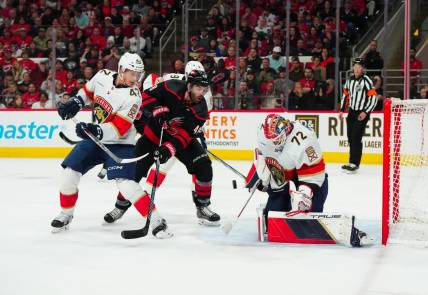 Mar 14, 2024; Raleigh, North Carolina, USA; Carolina Hurricanes left wing Jordan Martinook (48) shot attempt is stopped by Florida Panthers goaltender Sergei Bobrovsky (72) and defenseman Gustav Forsling (42) during the first period at PNC Arena. Mandatory Credit: James Guillory-USA TODAY Sports