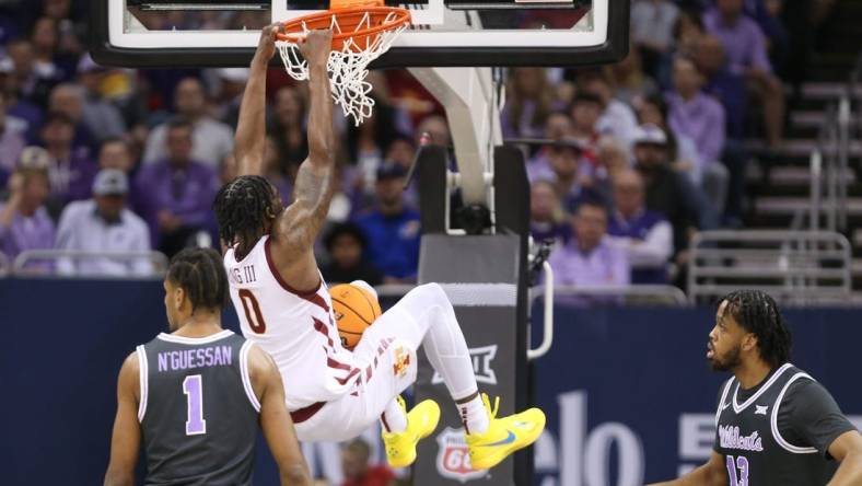 Iowa State senior forward Tre King (0) dunks over Kansas State in the first half of the quarterfinal round in the Big 12 Tournament inside the T-Mobile Center in Kansas City, Mo.