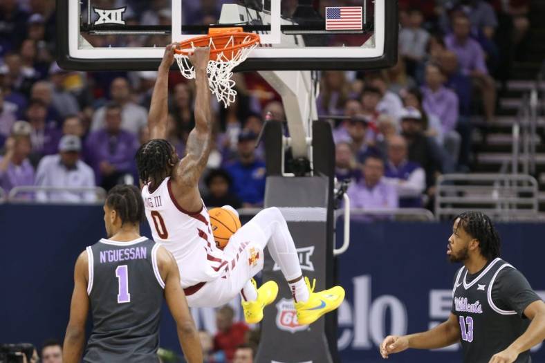 Iowa State senior forward Tre King (0) dunks over Kansas State in the first half of the quarterfinal round in the Big 12 Tournament inside the T-Mobile Center in Kansas City, Mo.