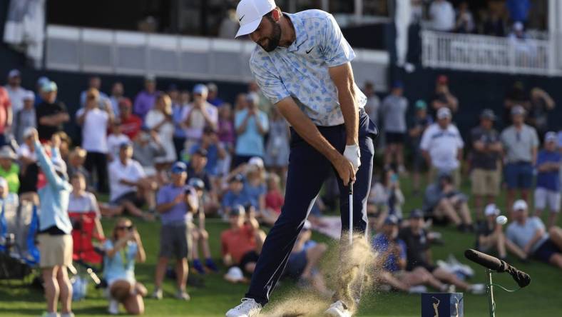 Scottie Scheffler tees off on hole 17 during the first round of The Players Championship PGA golf tournament Thursday, March 14, 2024 at TPC Sawgrass in Ponte Vedra Beach, Fla.