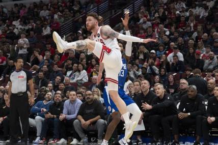 Mar 14, 2024; Chicago, Illinois, USA;  Chicago Bulls forward Onuralp Bitim (17) defends against LA Clippers forward Paul George (13) during the first half at the United Center. Mandatory Credit: Matt Marton-USA TODAY Sports