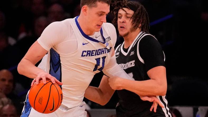 Mar 14, 2024; New York City, NY, USA;  Creighton Bluejays center Ryan Kalkbrenner (11) and Providence Friars forward Josh Oduro (13) square off during the second half at Madison Square Garden. Mandatory Credit: Robert Deutsch-USA TODAY Sports