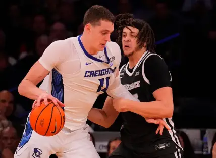 Mar 14, 2024; New York City, NY, USA;  Creighton Bluejays center Ryan Kalkbrenner (11) and Providence Friars forward Josh Oduro (13) square off during the second half at Madison Square Garden. Mandatory Credit: Robert Deutsch-USA TODAY Sports