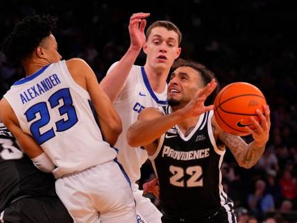 Mar 14, 2024; New York City, NY, USA;  Providence Friars guard Devin Carter (22) drives on Creighton Bluejays guard Trey Alexander (23) and center Ryan Kalkbrenner (11) during the second half at Madison Square Garden. Mandatory Credit: Robert Deutsch-USA TODAY Sports