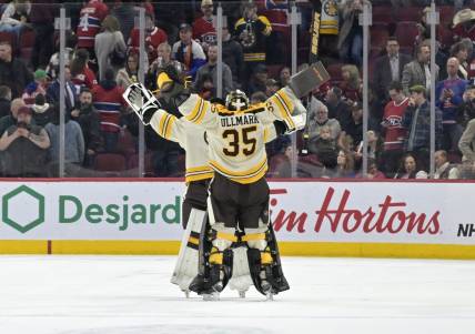 Mar 14, 2024; Montreal, Quebec, CAN; Boston Bruins goalie Linus Ullmark (35) celebrates with teammate goalie Jeremy Swayman (1) the win against the Montreal Canadiens in overtime at the Bell Centre. Mandatory Credit: Eric Bolte-USA TODAY Sports