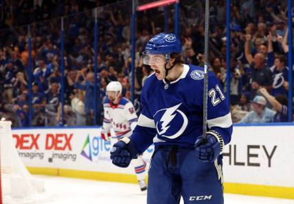 Mar 14, 2024; Tampa, Florida, USA; Tampa Bay Lightning center Brayden Point (21) celebrates after he scores a goal against the New York Rangers during the third period at Amalie Arena. Mandatory Credit: Kim Klement Neitzel-USA TODAY Sports