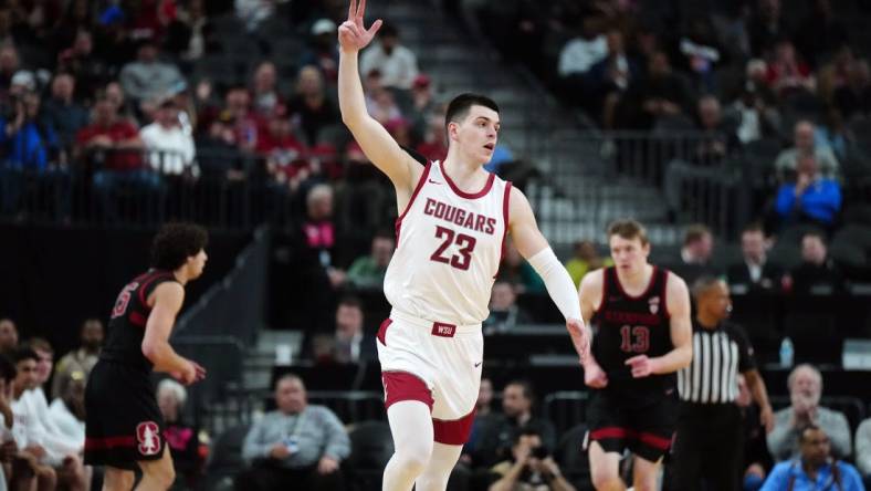 Mar 14, 2024; Las Vegas, NV, USA; Washington State Cougars forward Andrej Jakimovski (23) celebrates after a three-point basket against the Stanford Cardinal in the first half att T-Mobile Arena. Mandatory Credit: Kirby Lee-USA TODAY Sports