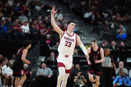 Mar 14, 2024; Las Vegas, NV, USA; Washington State Cougars forward Andrej Jakimovski (23) celebrates after a three-point basket against the Stanford Cardinal in the first half att T-Mobile Arena. Mandatory Credit: Kirby Lee-USA TODAY Sports