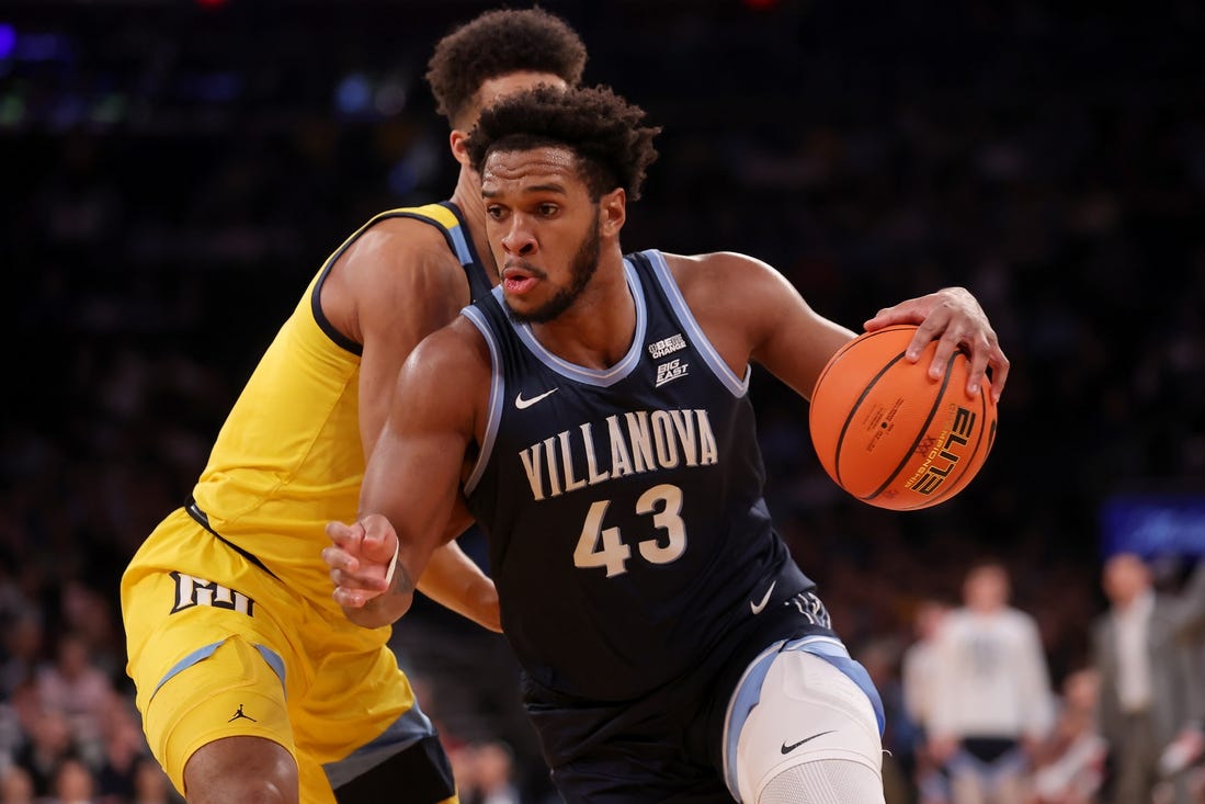 Mar 14, 2024; New York City, NY, USA; Villanova Wildcats forward Eric Dixon (43) drives to the basket against Marquette Golden Eagles forward Oso Ighodaro (13) during the first half at Madison Square Garden. Mandatory Credit: Brad Penner-USA TODAY Sports