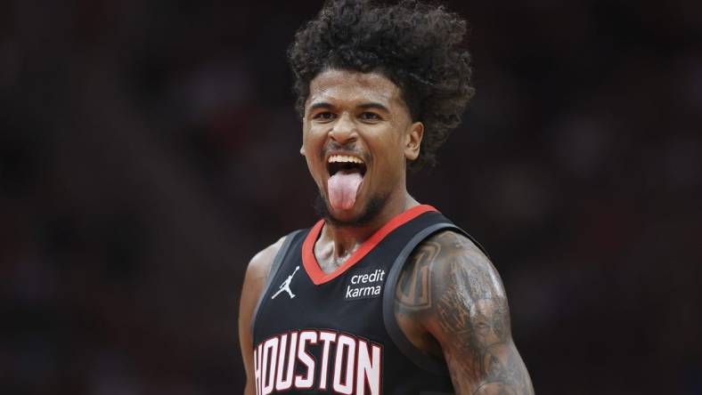 Mar 14, 2024; Houston, Texas, USA; Houston Rockets guard Jalen Green (4) reacts after making a basket during the third quarter against the Washington Wizards at Toyota Center. Mandatory Credit: Troy Taormina-USA TODAY Sports