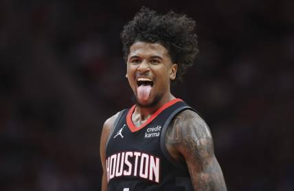 Mar 14, 2024; Houston, Texas, USA; Houston Rockets guard Jalen Green (4) reacts after making a basket during the third quarter against the Washington Wizards at Toyota Center. Mandatory Credit: Troy Taormina-USA TODAY Sports