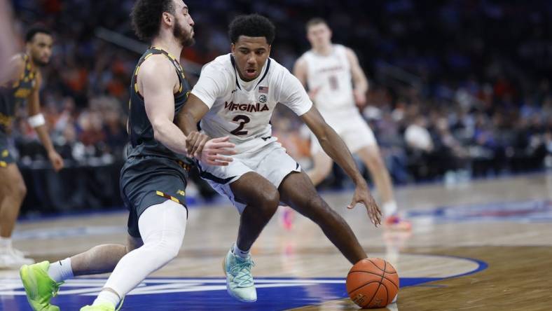 Mar 14, 2024; Washington, D.C., USA; Virginia Cavaliers guard Reece Beekman (2) drives to the basket as Boston College Eagles guard Jaeden Zackery (3) defends in the first half at Capital One Arena. Mandatory Credit: Geoff Burke-USA TODAY Sports