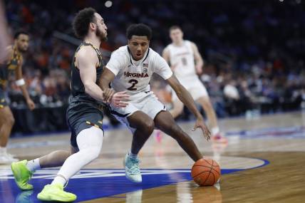 Mar 14, 2024; Washington, D.C., USA; Virginia Cavaliers guard Reece Beekman (2) drives to the basket as Boston College Eagles guard Jaeden Zackery (3) defends in the first half at Capital One Arena. Mandatory Credit: Geoff Burke-USA TODAY Sports