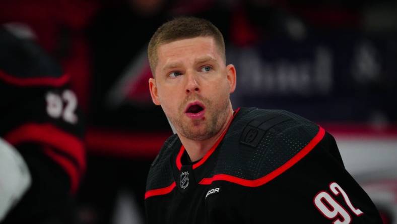 Mar 14, 2024; Raleigh, North Carolina, USA; Carolina Hurricanes center Evgeny Kuznetsov (92) looks on against the Florida Panthers during the warmups before the game against the Florida Panthers at PNC Arena. Mandatory Credit: James Guillory-USA TODAY Sports