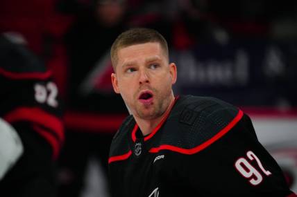 Mar 14, 2024; Raleigh, North Carolina, USA; Carolina Hurricanes center Evgeny Kuznetsov (92) looks on against the Florida Panthers during the warmups before the game against the Florida Panthers at PNC Arena. Mandatory Credit: James Guillory-USA TODAY Sports