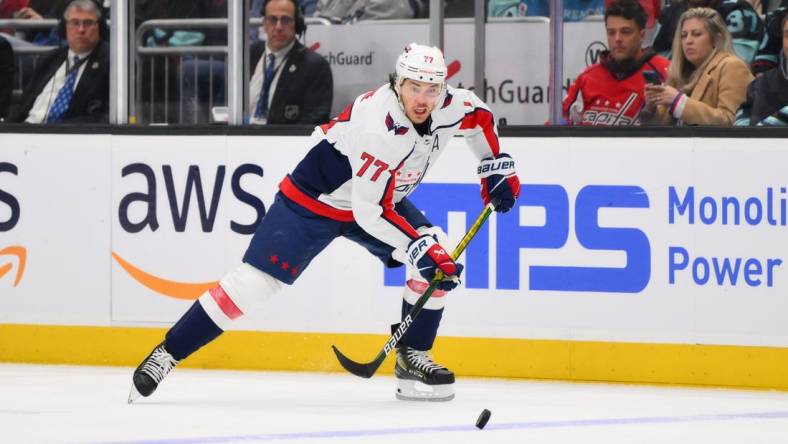 Mar 14, 2024; Seattle, Washington, USA; Washington Capitals right wing T.J. Oshie (77) plays the puck during the third period against the Seattle Kraken at Climate Pledge Arena. Mandatory Credit: Steven Bisig-USA TODAY Sports