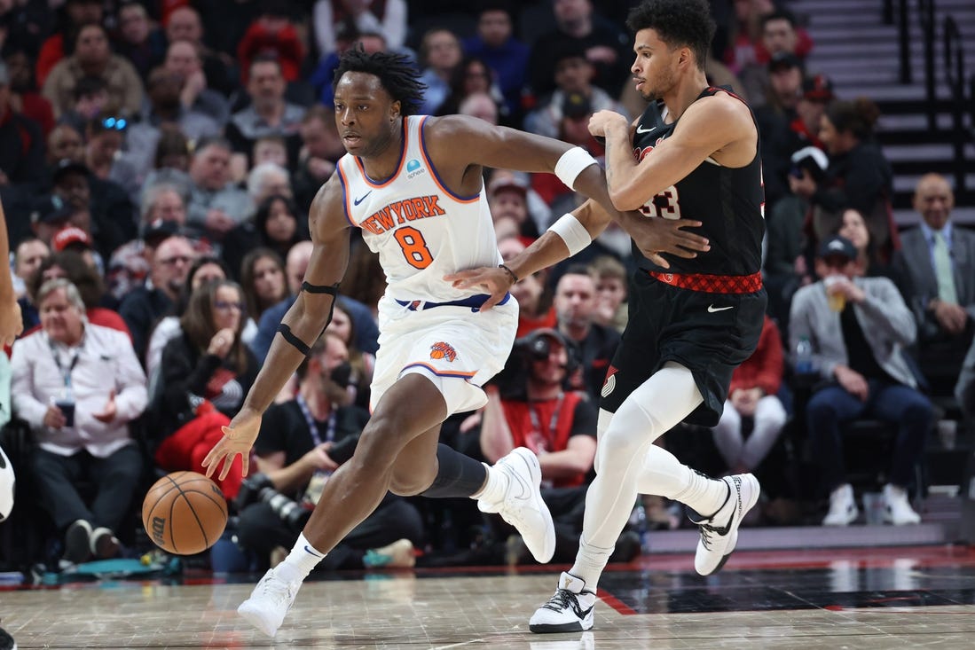 Mar 14, 2024; Portland, Oregon, USA;  New York Knicks forward OG Anunoby (8) controls the ball against Portland Trail Blazers forward Toumani Camara (33) in the fourth quarter at Moda Center. Mandatory Credit: Jaime Valdez-USA TODAY Sports