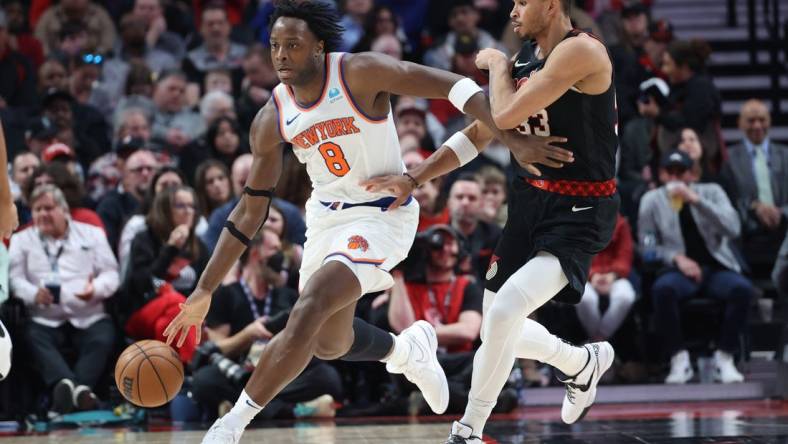 Mar 14, 2024; Portland, Oregon, USA;  New York Knicks forward OG Anunoby (8) controls the ball against Portland Trail Blazers forward Toumani Camara (33) in the fourth quarter at Moda Center. Mandatory Credit: Jaime Valdez-USA TODAY Sports