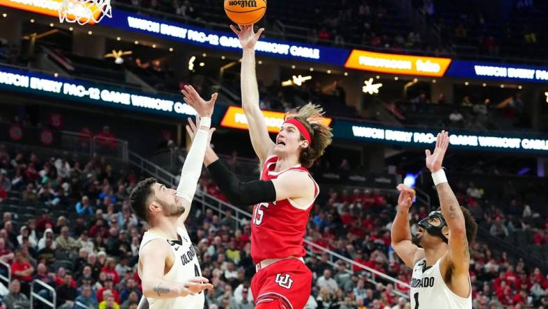 Mar 14, 2024; Las Vegas, NV, USA; Utah Utes center Branden Carlson (35) shoots between Colorado Buffaloes guard Luke O'Brien (0) and guard J'Vonne Hadley (1) during the second half at T-Mobile Arena. Mandatory Credit: Stephen R. Sylvanie-USA TODAY Sports