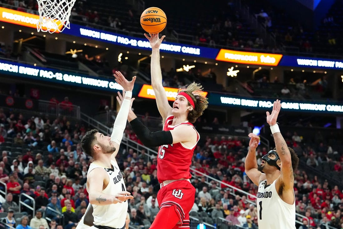 Mar 14, 2024; Las Vegas, NV, USA; Utah Utes center Branden Carlson (35) shoots between Colorado Buffaloes guard Luke O'Brien (0) and guard J'Vonne Hadley (1) during the second half at T-Mobile Arena. Mandatory Credit: Stephen R. Sylvanie-USA TODAY Sports