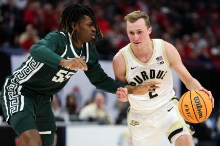 Mar 15, 2024; Minneapolis, MN, USA; Purdue Boilermakers guard Fletcher Loyer (2) works around Michigan State Spartans forward Coen Carr (55) during the first half at Target Center. Mandatory Credit: Matt Krohn-USA TODAY Sports