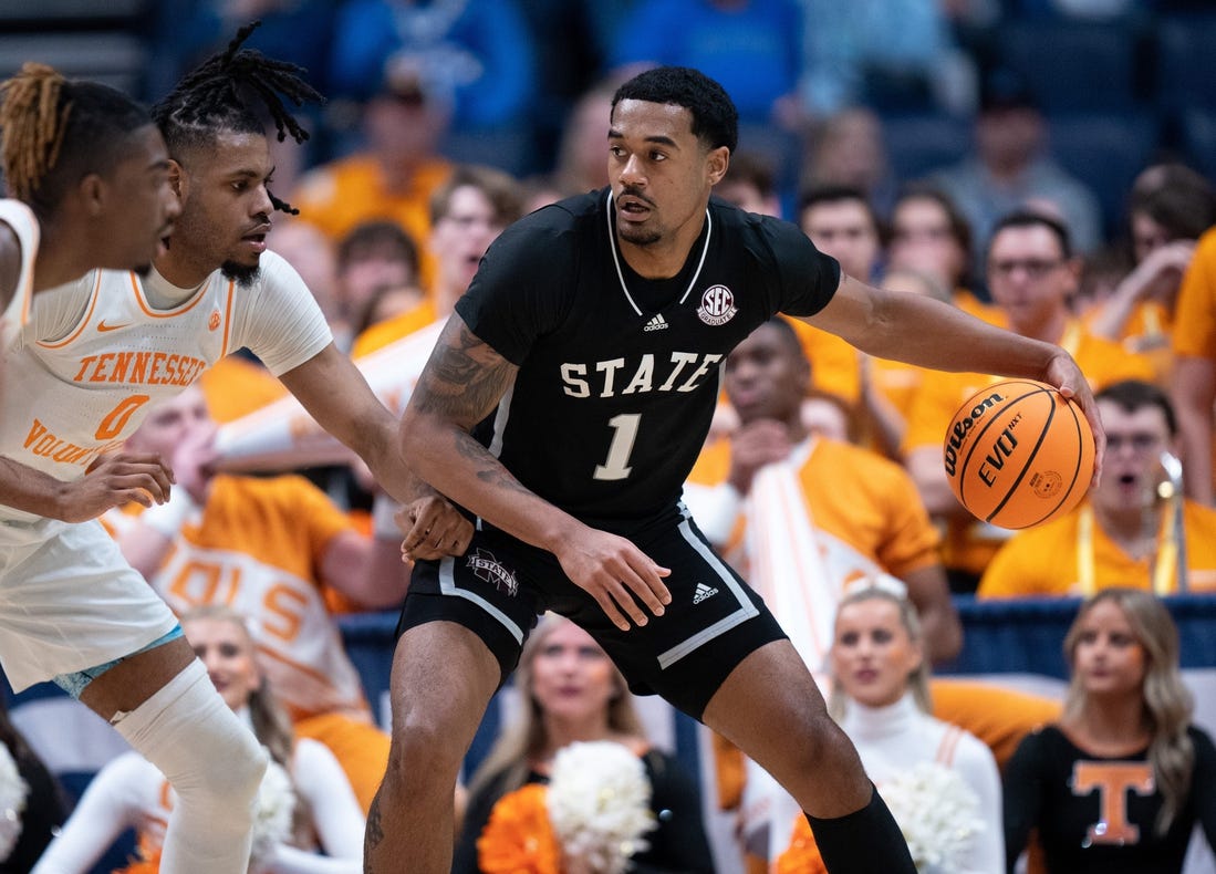 Mississippi State Bulldogs forward Tolu Smith (1) drives against Tennessee Volunteers forward Jonas Aidoo (0) during their SEC Men's Basketball Tournament quarterfinal game at Bridgestone Arena in Nashville, Tenn., Friday, March 15, 2024.