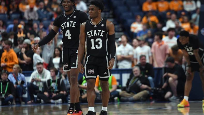 Mar 15, 2024; Nashville, TN, USA; Mississippi State Bulldogs forward Cameron Matthews (4) and guard Josh Hubbard (13) celebrate late in the second half of a win against the Tennessee Volunteers at Bridgestone Arena. Mandatory Credit: Christopher Hanewinckel-USA TODAY Sports