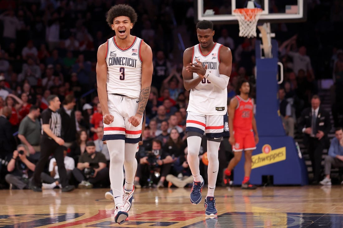 Mar 15, 2024; New York City, NY, USA; Connecticut Huskies forwards Jaylin Stewart (3) and Samson Johnson (35) react during the first half against the St. John's Red Storm at Madison Square Garden. Mandatory Credit: Brad Penner-USA TODAY Sports