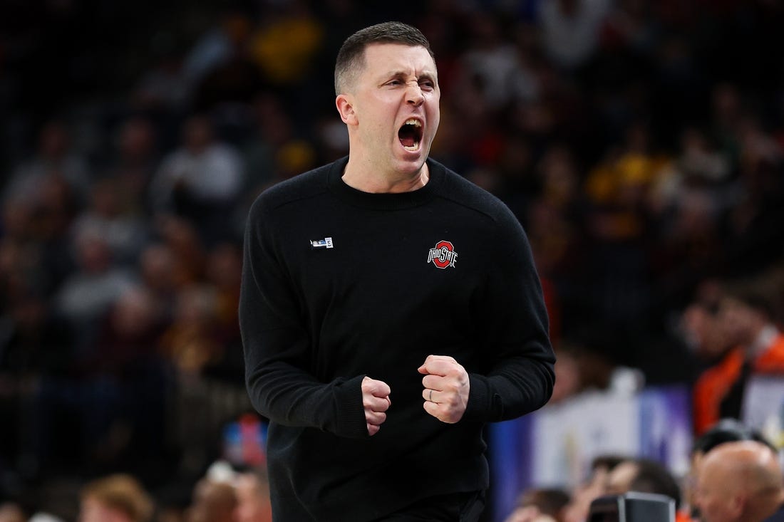 Mar 15, 2024; Minneapolis, MN, USA; Ohio State Buckeyes head coach Jake Diebler celebrates during the first half against the Illinois Fighting Illini at Target Center. Mandatory Credit: Matt Krohn-USA TODAY Sports