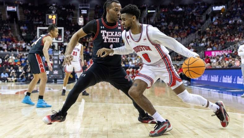 Mar 15, 2024; Kansas City, MO, USA; Houston Cougars guard Mylik Wilson (8) drives around Texas Tech Red Raiders guard Lamar Washington (1) during the first half at T-Mobile Center. Mandatory Credit: William Purnell-USA TODAY Sports