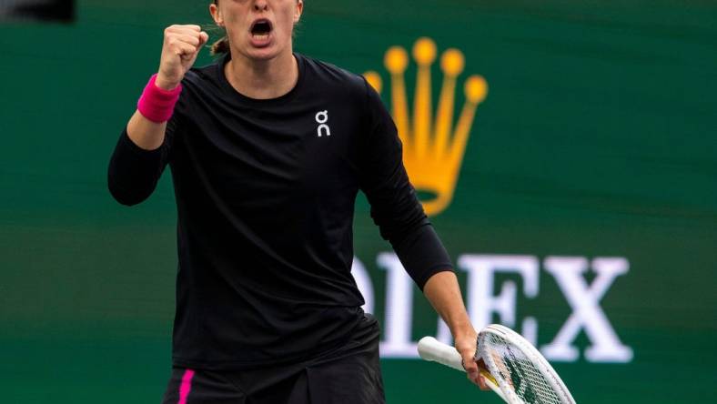 Iga Swiatek celebrates winning the fifth game of the second set against Marta Kostyuk during the WTA semifinals of the BNP Paribas Open in Indian Wells, Calif., Friday, March 15, 2024.